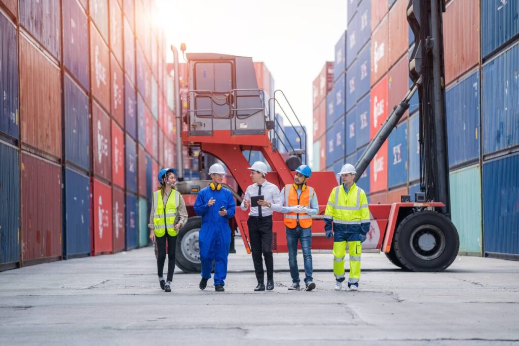 Manager and Cargo container worker having discussion on working plan together in the container yard,Logistics transportation and shipping business concepts Logistics Solutions