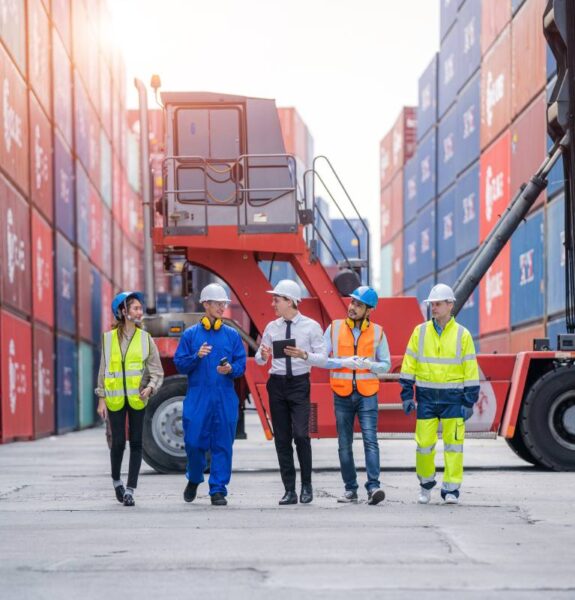 Manager and Cargo container worker having discussion on working plan together in the container yard,Logistics transportation and shipping business concepts Logistics Solutions