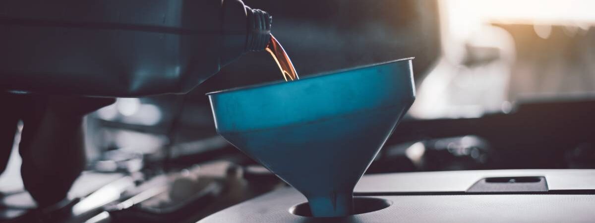 Mechanic lubricant oil motor level for refueling and pouring oil quality into the engine motor car Transmission and Maintenance.