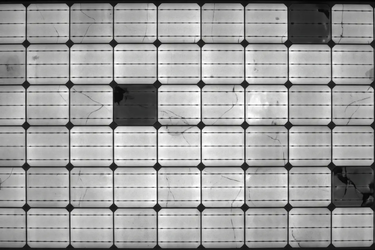 Electroluminescence scan revealing microcracks across a solar panel's cells